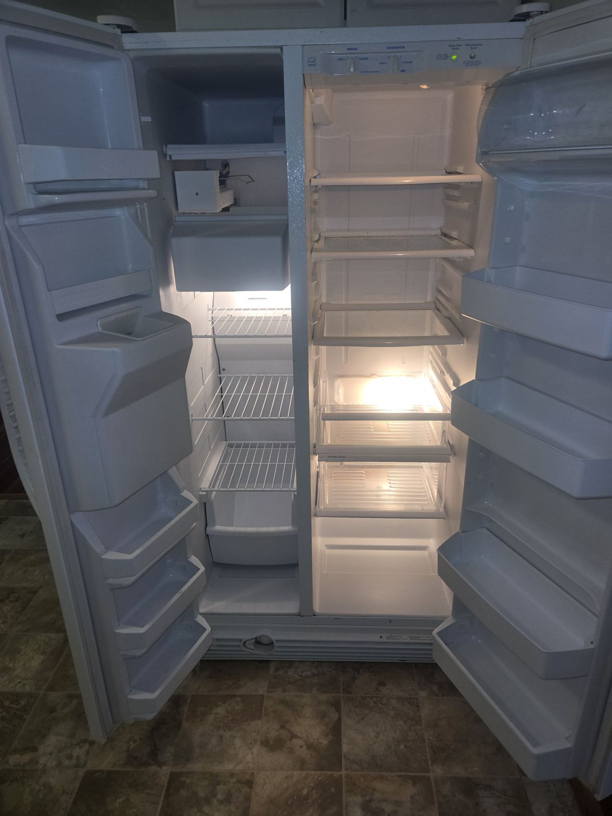 Refrigerator interior cleaned shelf by shelf